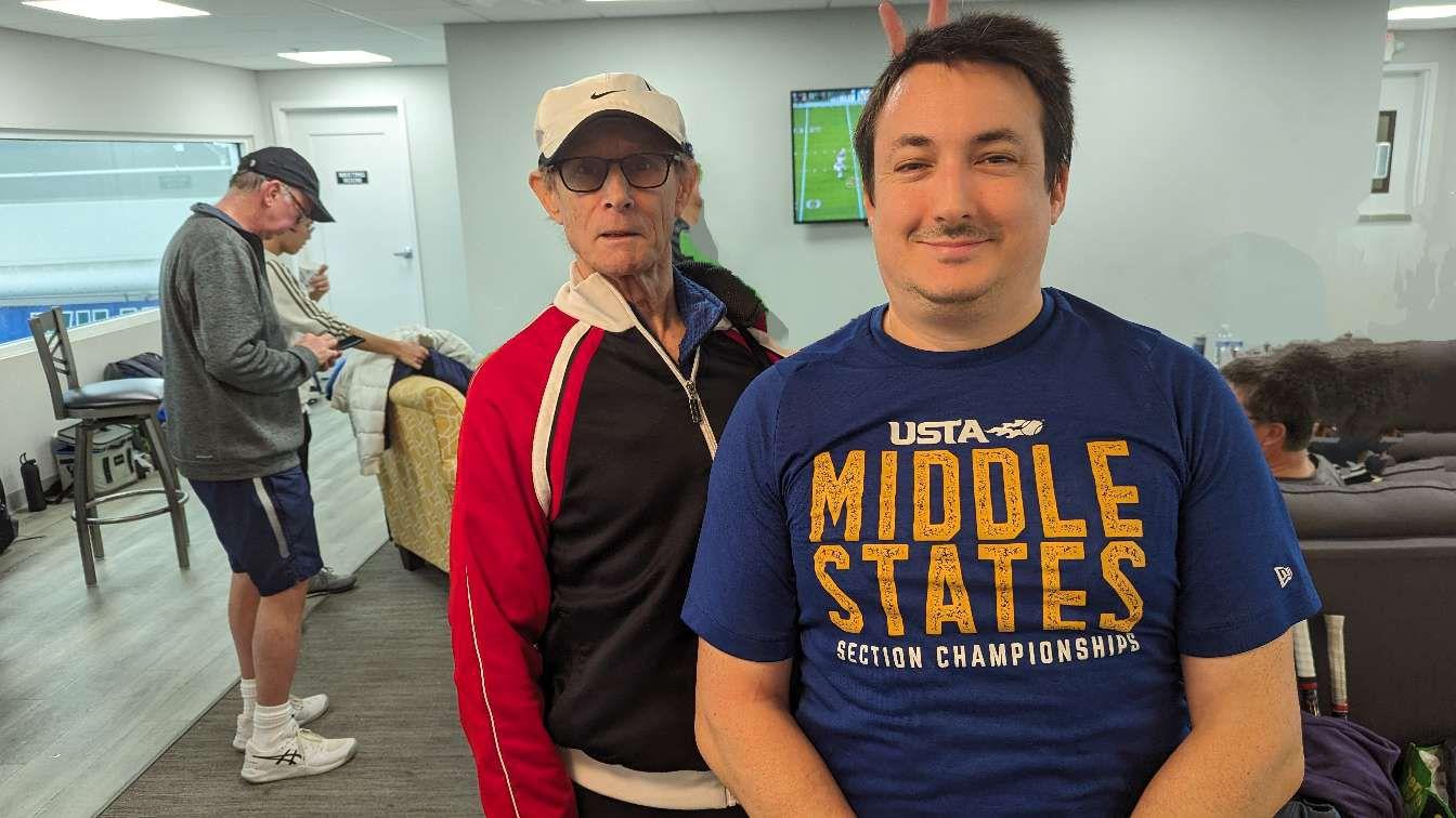 Bob Davis on the tennis court with the community